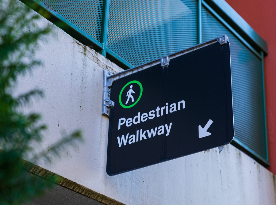 Street view of pedestrian path walkway sign